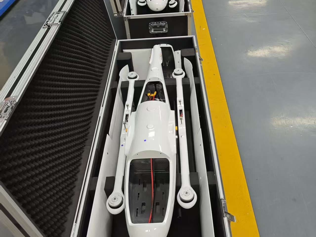Hybrid VTOL fixed-wing UAV in its transit case